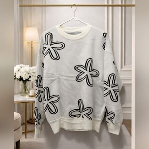 NWOT Boutique White and Grey Size Large Sweater with Black Flower Pattern